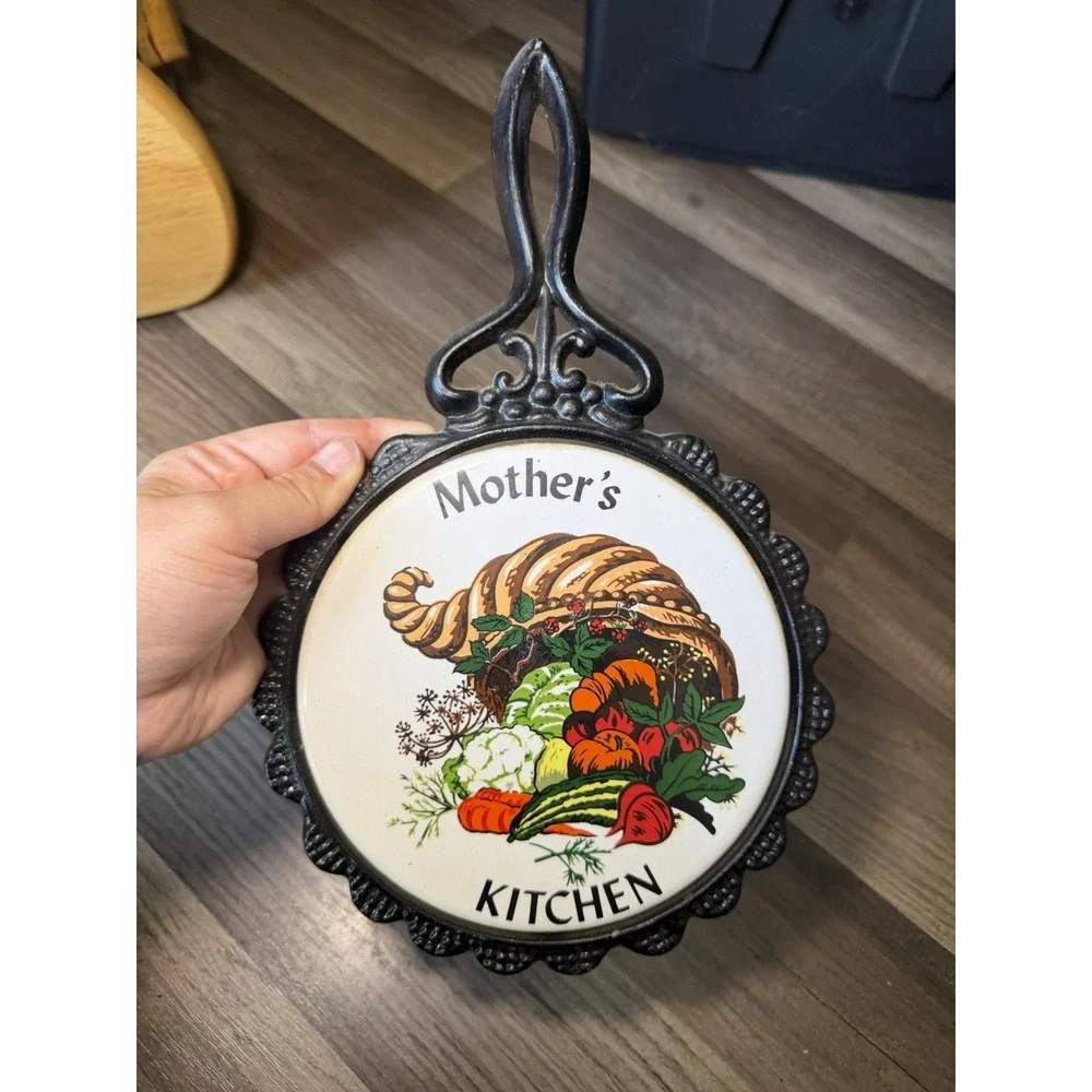 Vintage Mother's Kitchen Black And Ceramic Trivet. With A Cornucopia Design